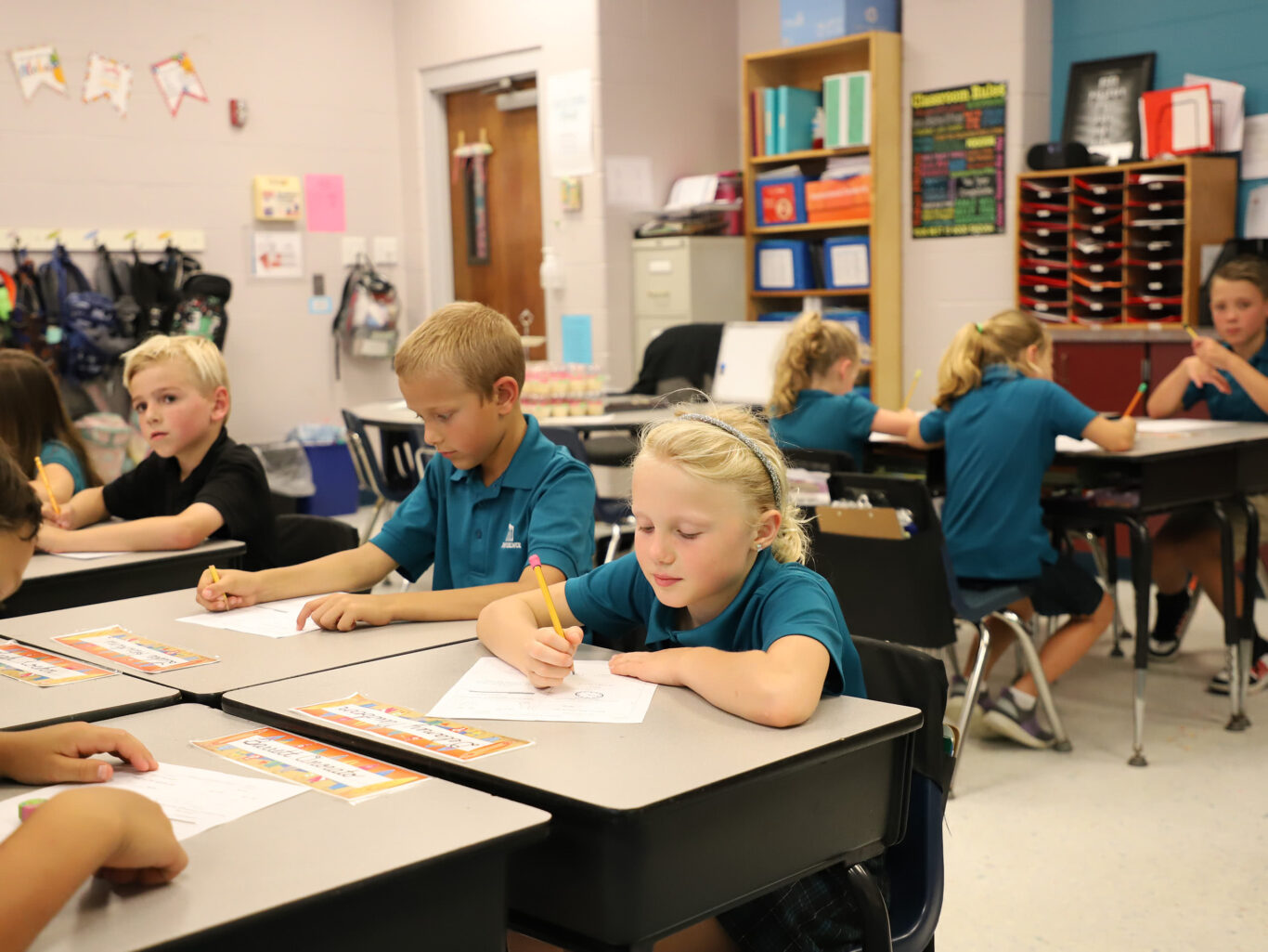 A group of important kids in a Lower School classroom.