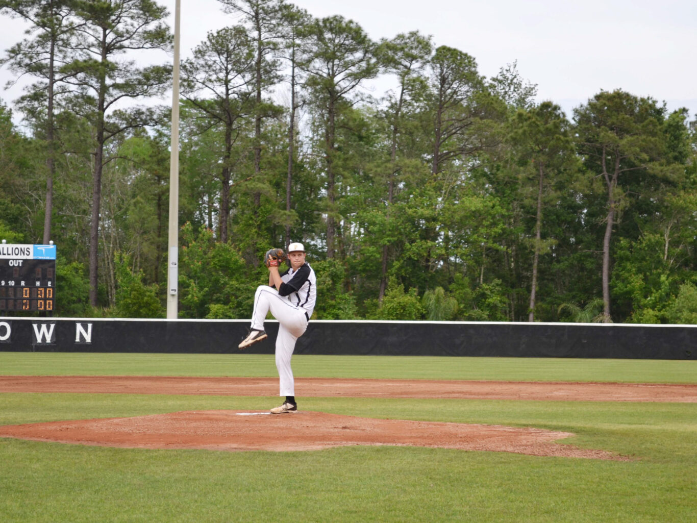 A player is pitching a ball.