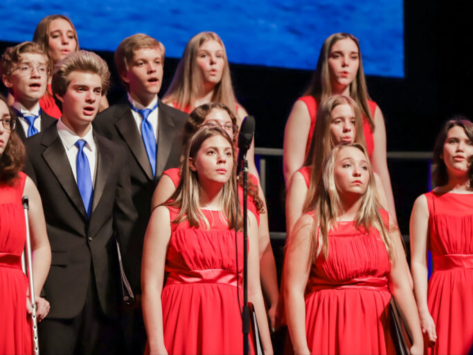 Fine Arts enthusiasts singing in a choir.