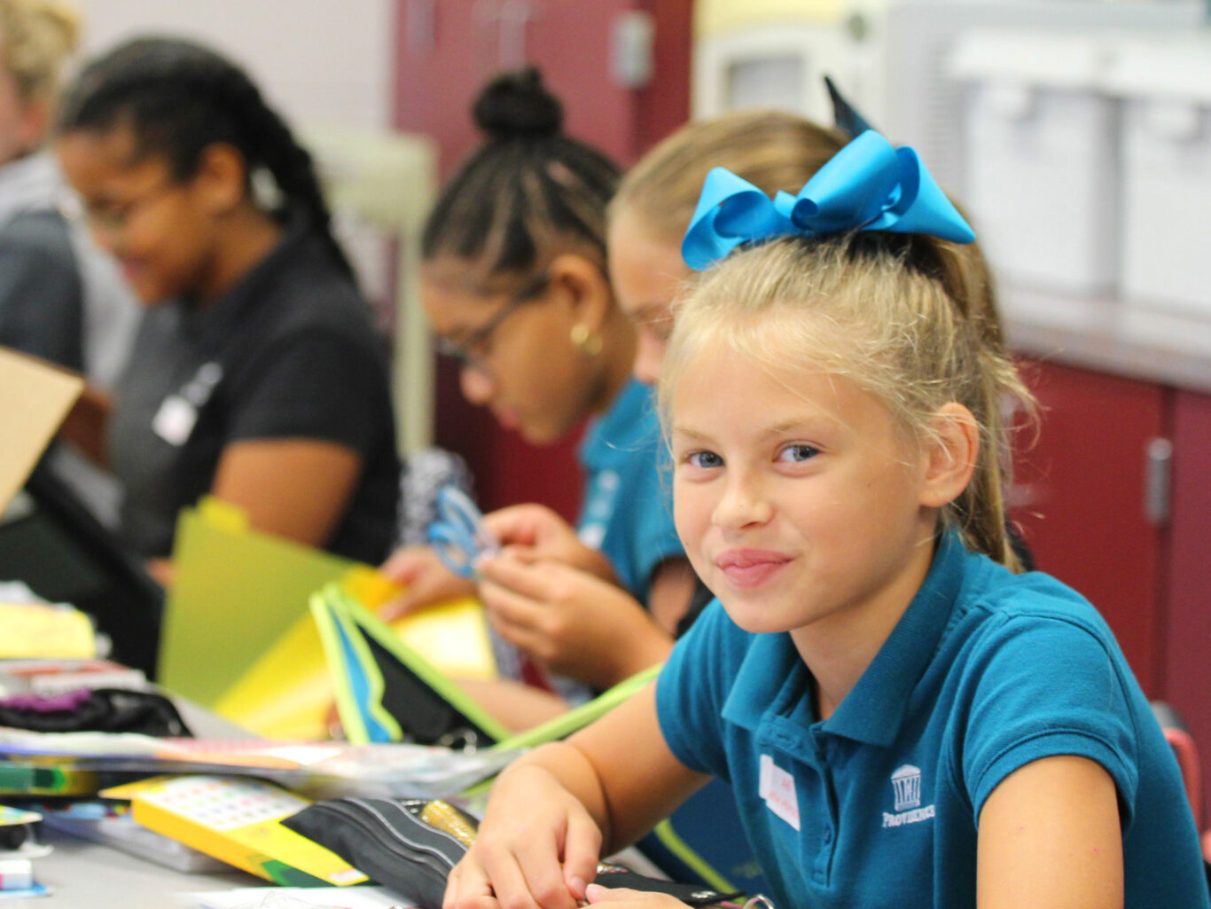 A girl seeking employment wearing a blue shirt.