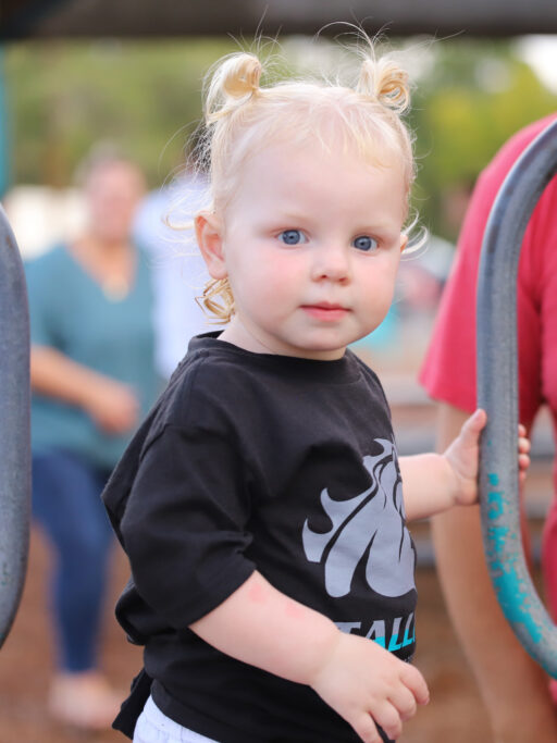 A preschooler wearing a black shirt.