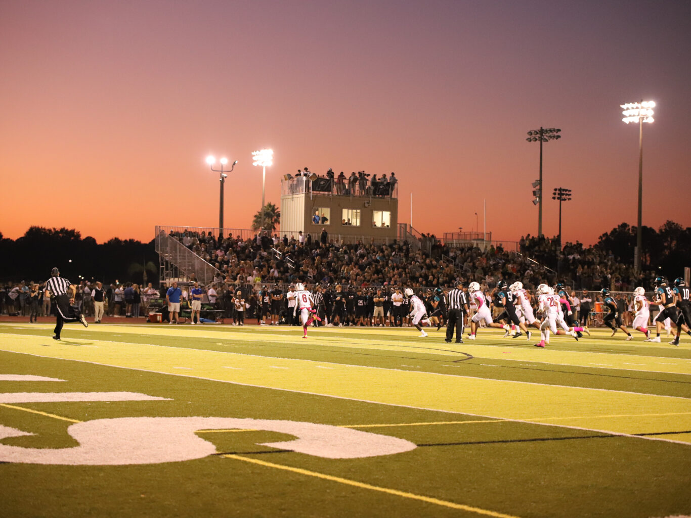 A football field at dusk.