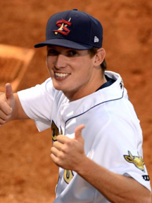A pro baseball player giving the thumbs up.