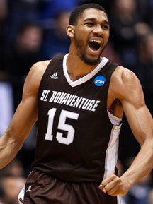College basketball player celebrating during a game for St. Robert's.