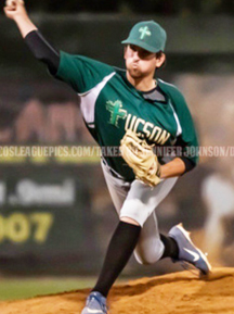 A college baseball player is pitching a ball during a game.