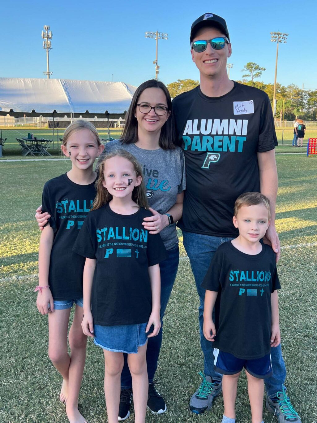 Stallion family poses at an event.