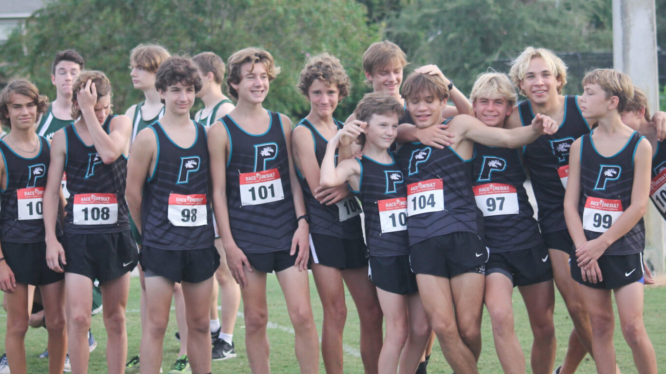 A group of Cross Country boys posing for a picture.