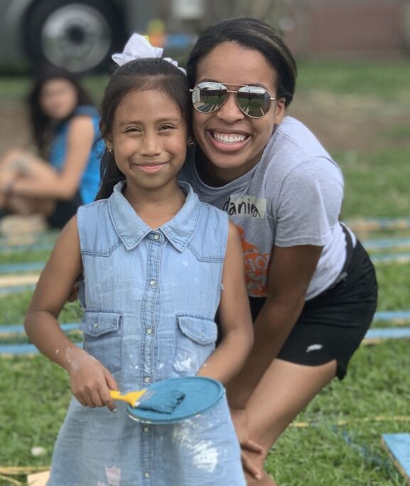 A woman and a young girl engaged in a spiritual photo pose.