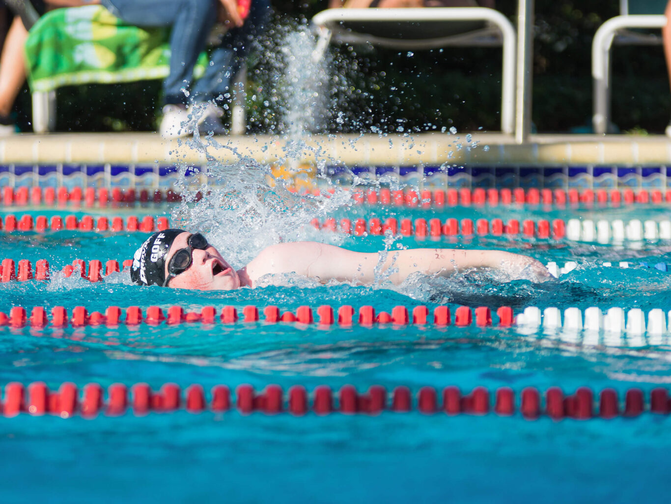 A girl is swimming.