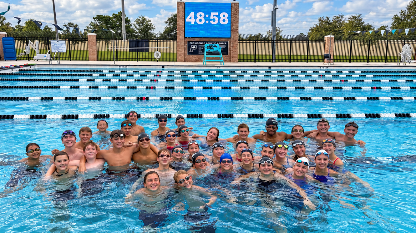 smiling swim team at stallions pool
